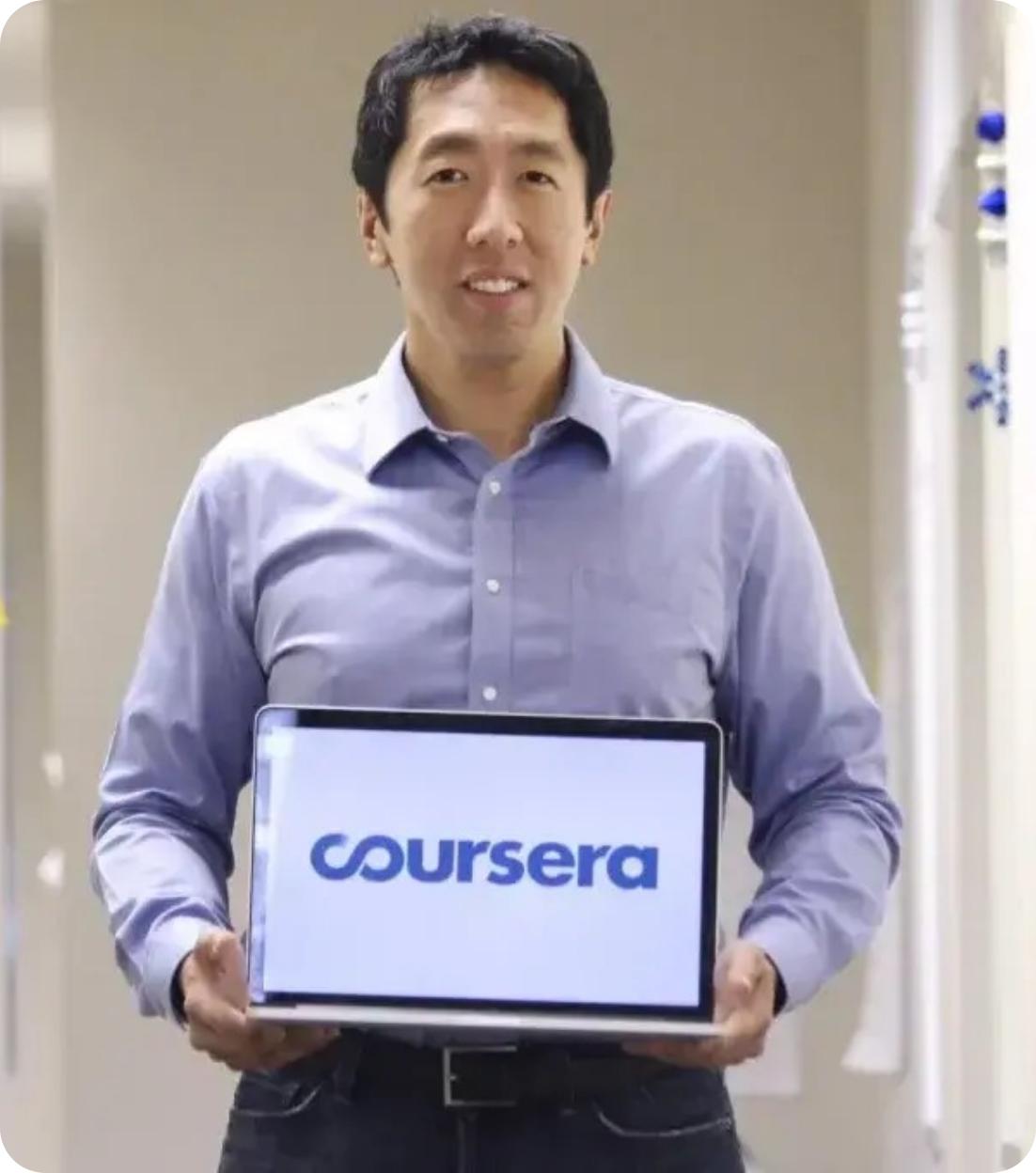 Andrew Ng holding a laptop showing Coursera