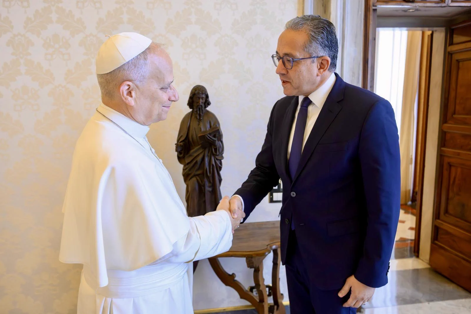 Pope Leo XIV shaking hands with UNESCO Director-General Khaled El-Enany